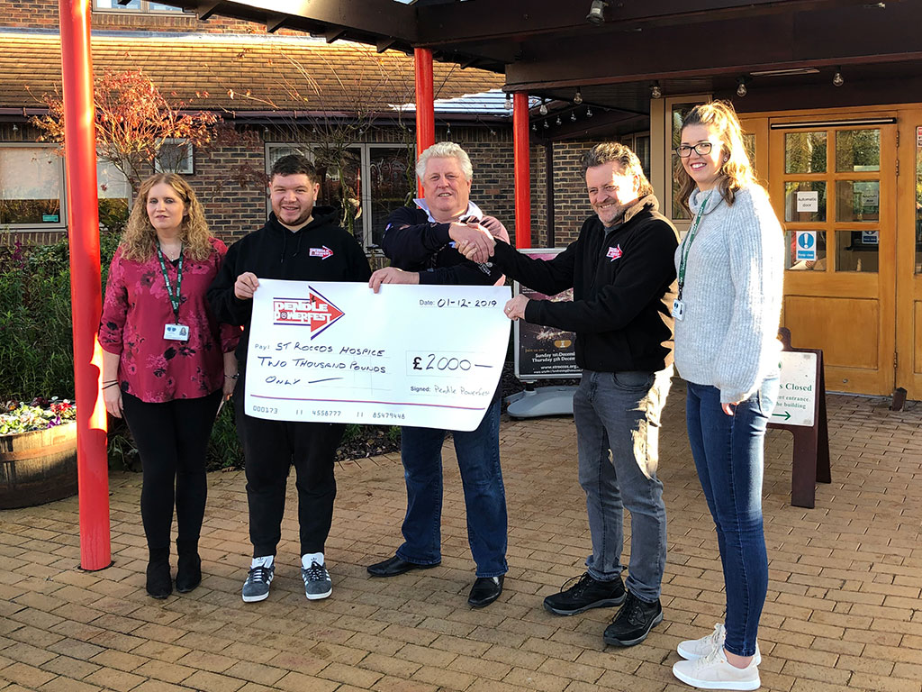 Pendle Powerfest present  a cheque for £2,000 to St Rocco's Hospice in memory of Jamie Arnold