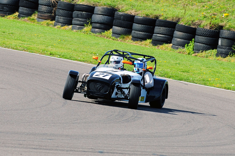 Matt Spark thrills a passenger at Peel in his Caterham