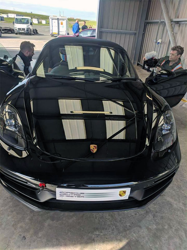 Joel getting comfotable in a new Boxster
