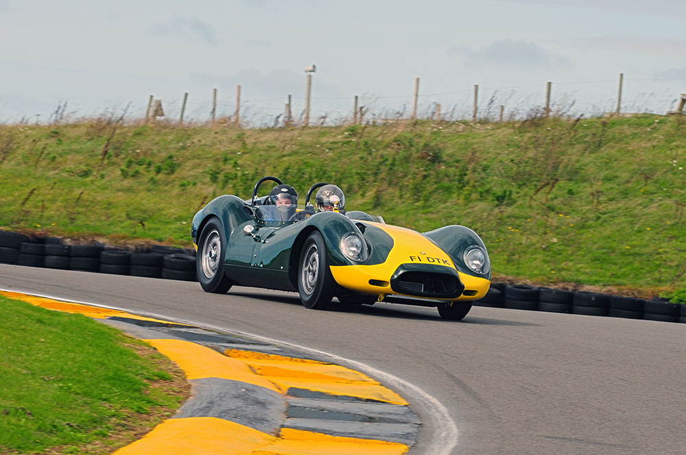 A Lister Jaguar enters the Corkscrew